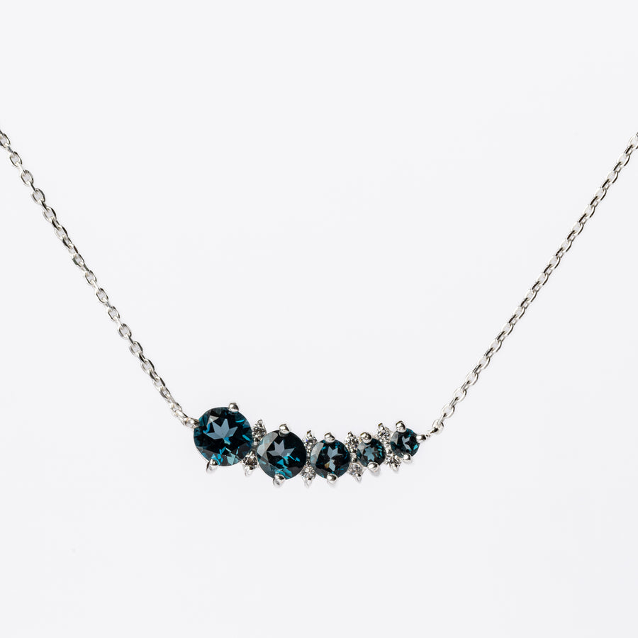Graduated Blue Topaz Necklace with Caterpillar Design on Silver Chain