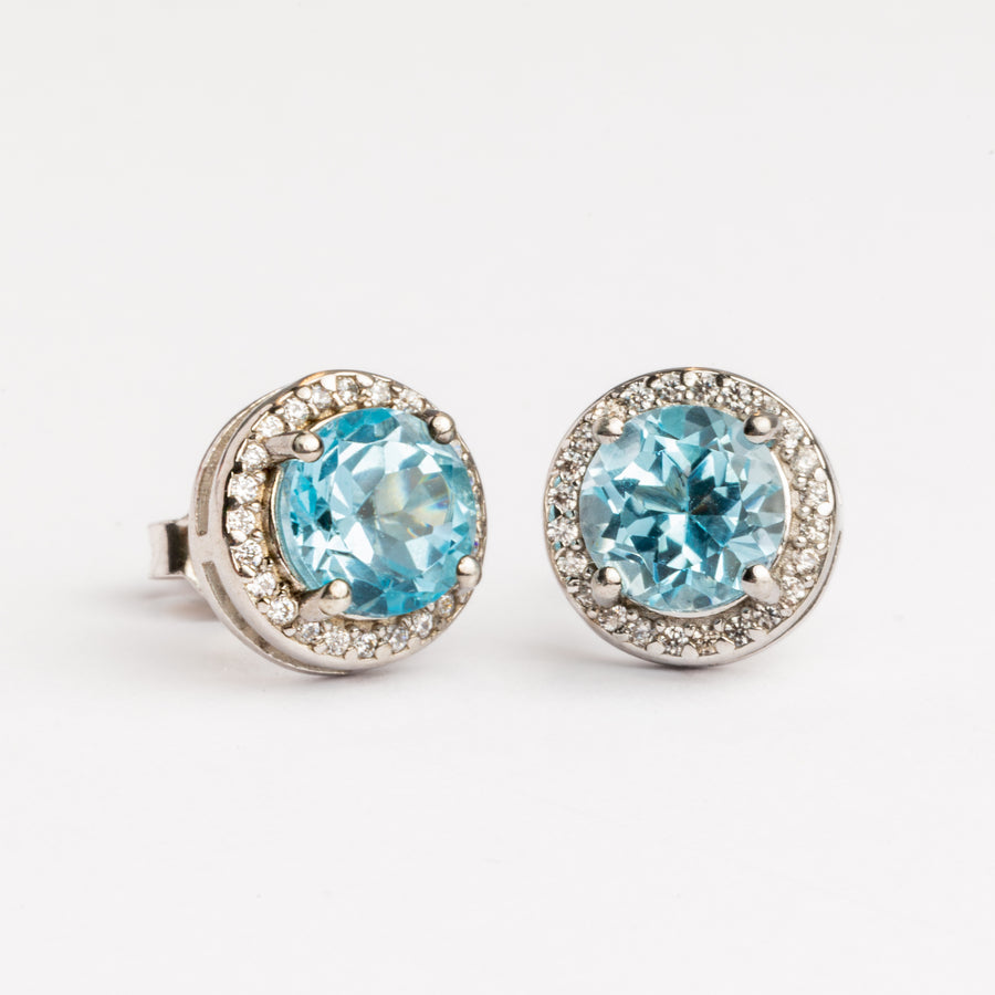 Light Blue Topaz Earrings Surrounded by Zirconia Halo